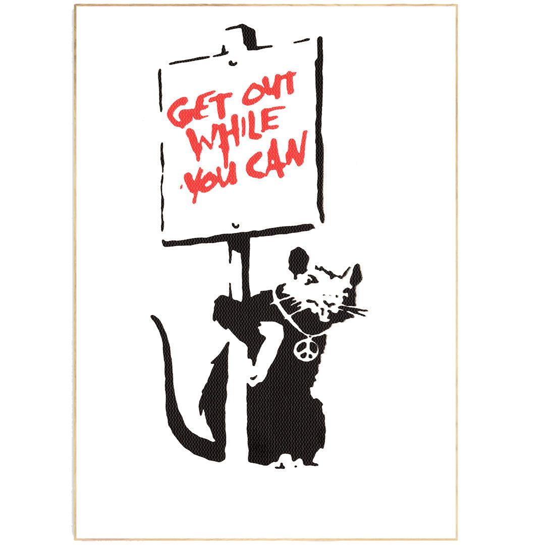 This Rat by Banksy Art Print features the iconic street art image of a rat holding a paintbrush. The ideal addition to any art lover's collection, this print is sure to start a conversation. Printed on high-quality paper, this print is sure to stand the test of time.