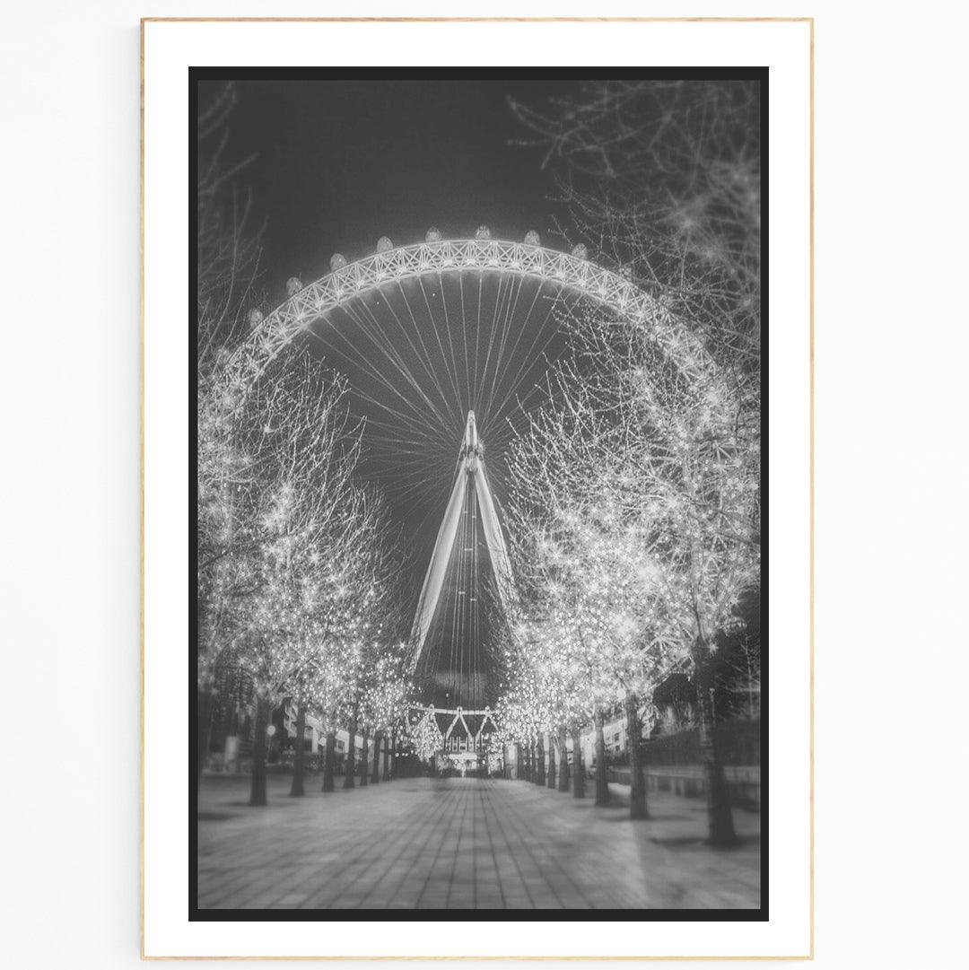 London Eye Black And White Night Print. This photographic print offers a stunning panoramic view of London, featuring London Eye, Big Ben, Tower Bridge and night photography of the city. With fresh images of the city's skylines, this print is ideal for anyone wanting to bring a piece of London into their home. Perfect for any fan of photography or the city, this print offers the highest quality photographic prints for sale with a professional finish.