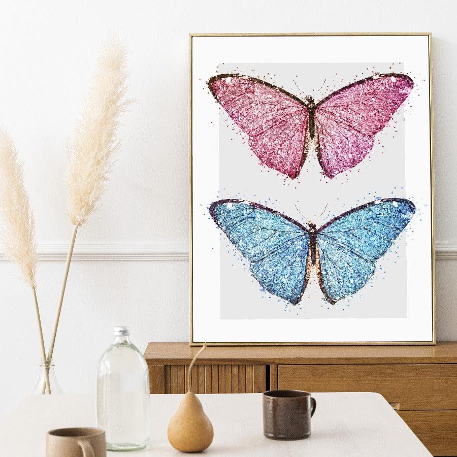 Graphic illustration of sparkling and bright pink and blue butterflies. This bold and colourful design is a perfect fit for the home of a maximalist wall Art decor.