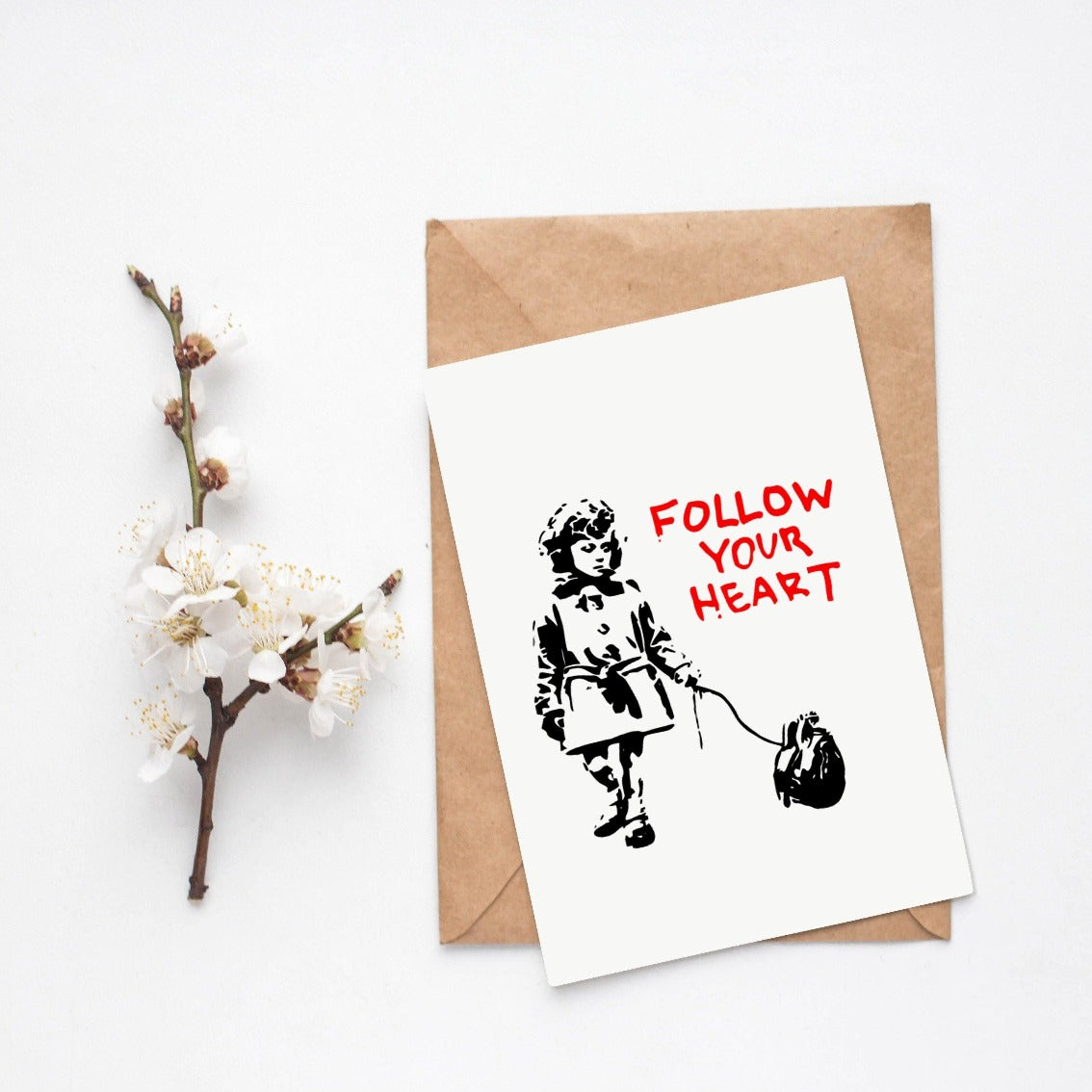A beloved street artist brings his iconic style to your walls. Banksy is a street artist whose work has captured the hearts of people all over the world. He is known for his dark humor and political statements. Bring Banksy's art into your home with this beautiful print. Let the message "follow your heart" inspire you every day.