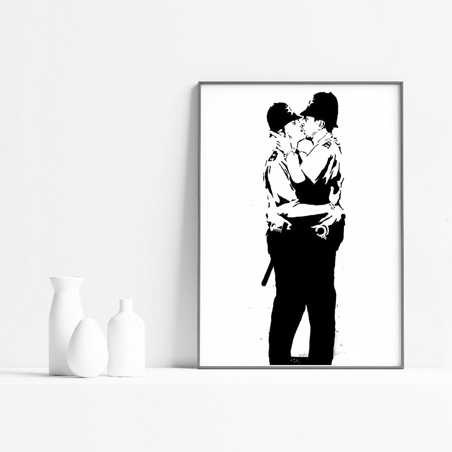 Graffiti lovers rejoice! The perfect addition to your art collection, this Kissing Police Banksy Poster is a must-have. From the acclaimed street artist, this poster is sure to make a statement. With its bright colors and bold graphics, it's sure to turn heads. Whether you're a Banksy fan or just love street art, this poster is a must-have for your collection. - 98types
