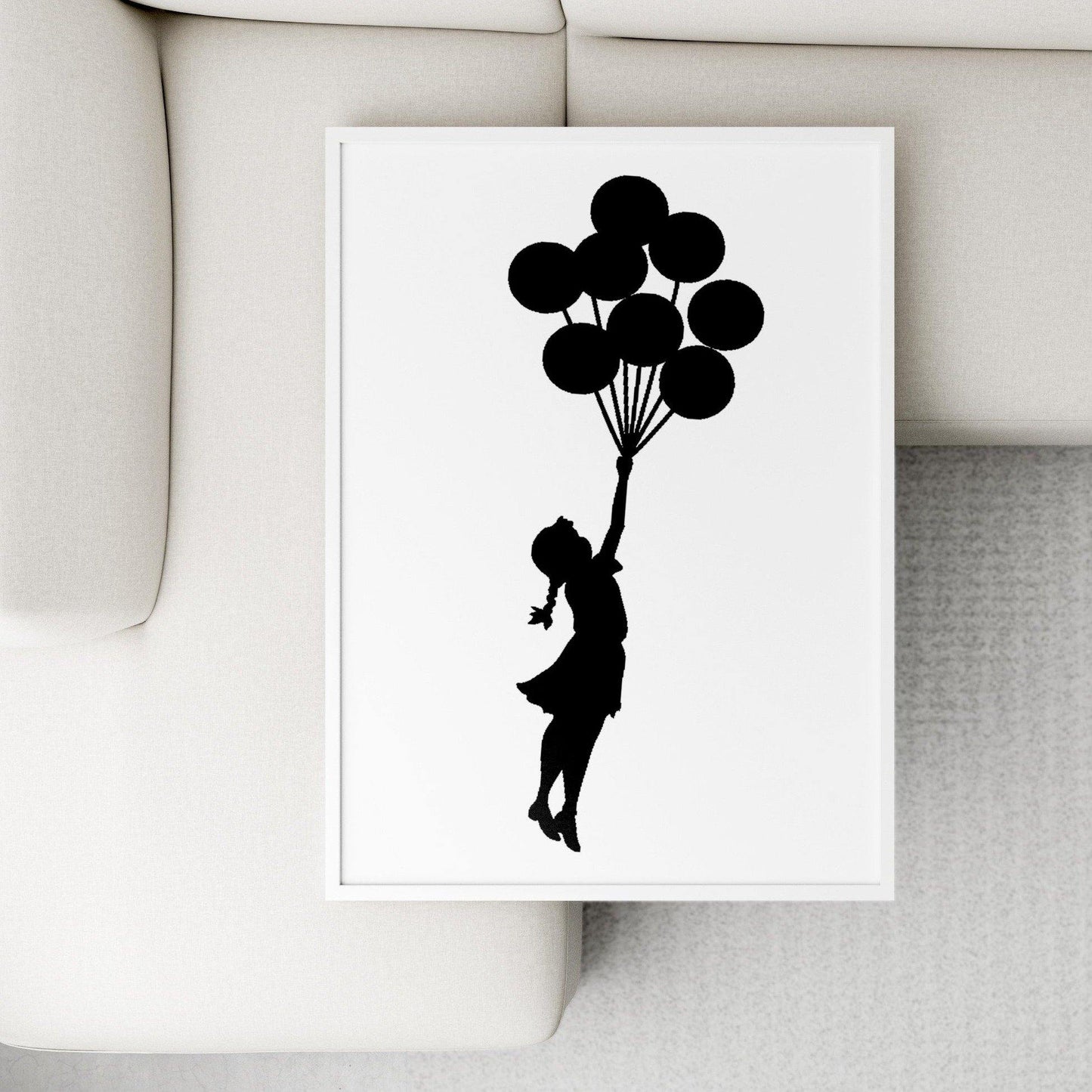 A beloved street artist comes to life in this limited edition Banksy print. Banksy is one of the most famous street artists in the world, and this piece is a perfect embodiment of his work. A young girl triumphantly holds onto a bunch of balloons, as if escaping from the everyday. Perfect for the art lover in your life, this print is a must-have for any Banksy fan. Hang it up in your home and enjoy looking at it every day.