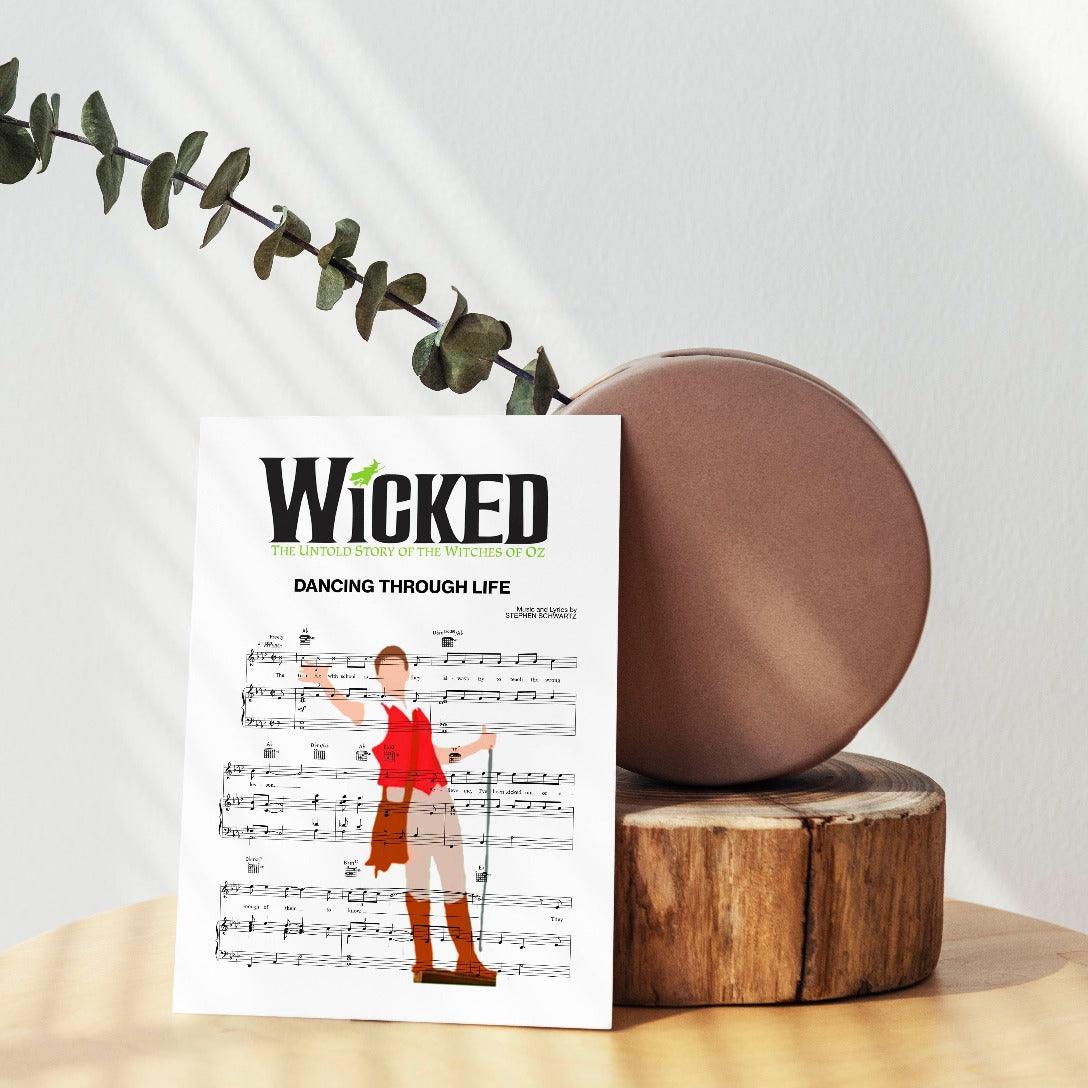 Our wicked - DANCING THROUGH LIFE Poster offers the perfect blend of music lyrics, wall art, framed art, and wall prints to bring vibrancy and joy to your home. Each poster is printed on premium quality cardstock and comes framed, making it a delightful song lyric gift. With its scientifically and professionally produced print, it is the perfect addition to any room.