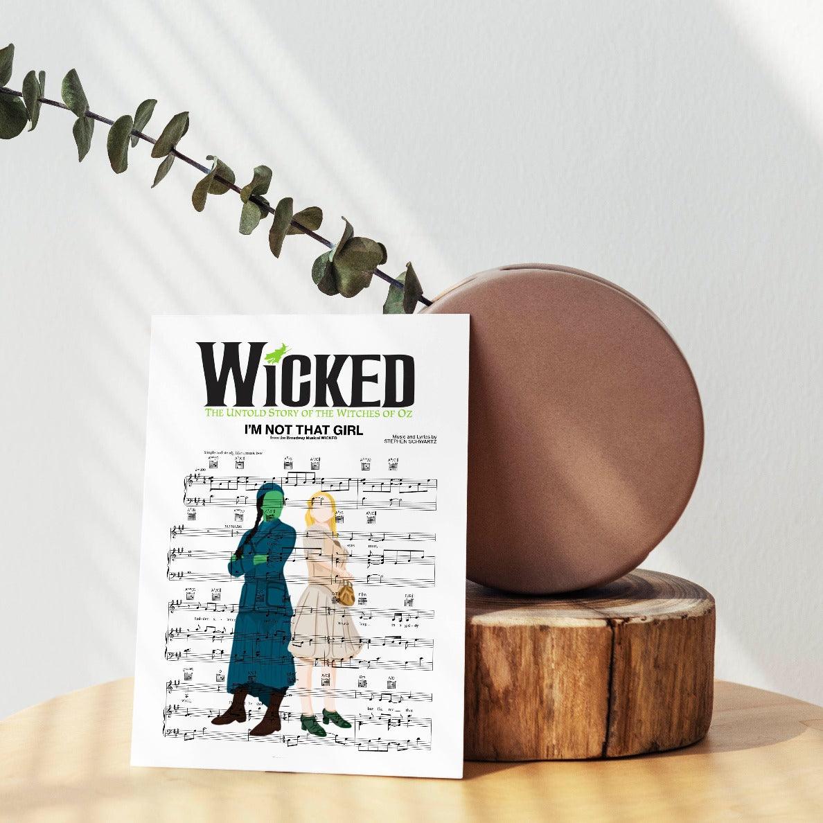 Hey, you! Yeah, you, the one who loves musicals. (Everyone loves musicals, right?) We’ve got just the thing to add some extra pizzazz to your walls. This poster of the song “I’m Not That Girl” from the musical Wicked is perfect for the musical lover in your life. It’s not just a poster, it’s a work of art. The lyrics are hand-crafted into the beautiful design, making it a one-of-a-kind piece for your home.